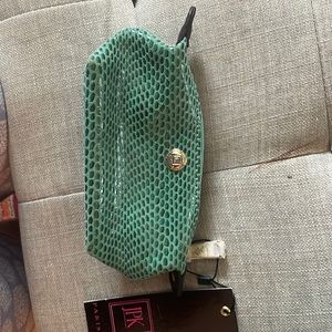 NWT: 7 x 4 inches . Can hold change, cosmetics, etc.